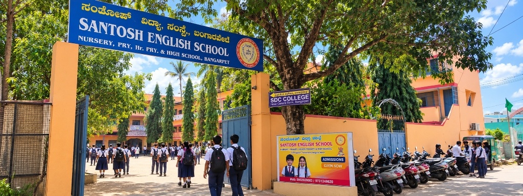 Santosh English School and High School entrance gate with students in Bangarpet